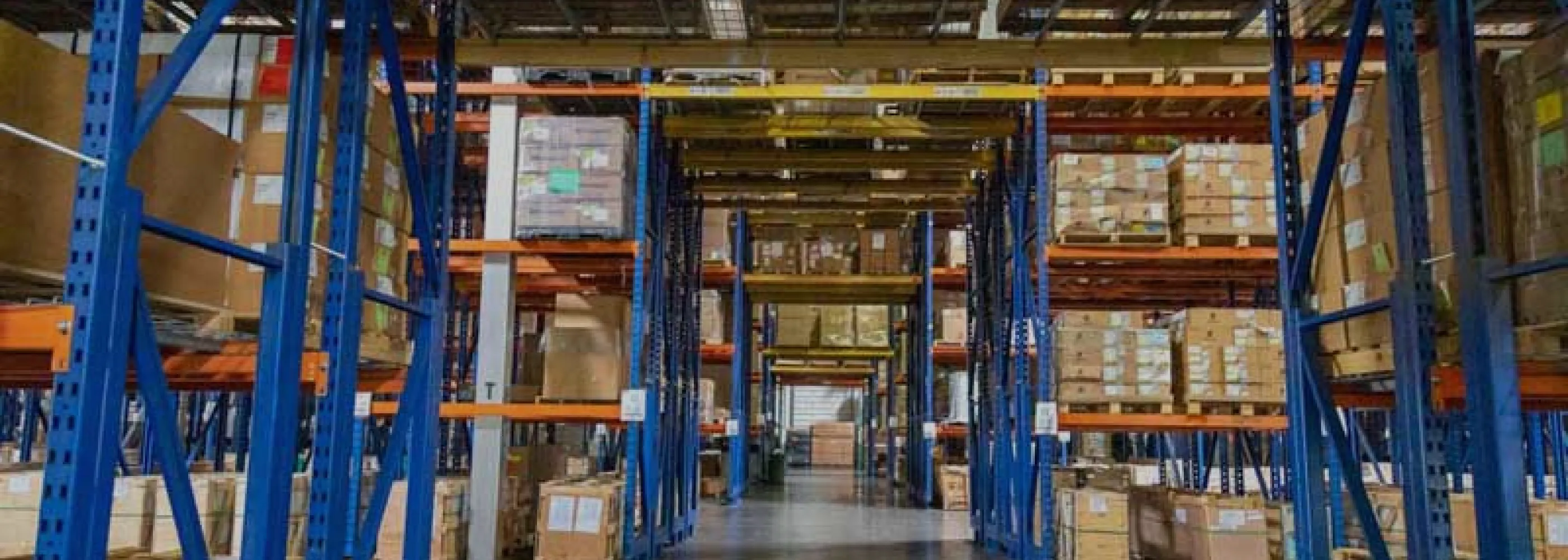 Warehouse interior with tall industrial shelving