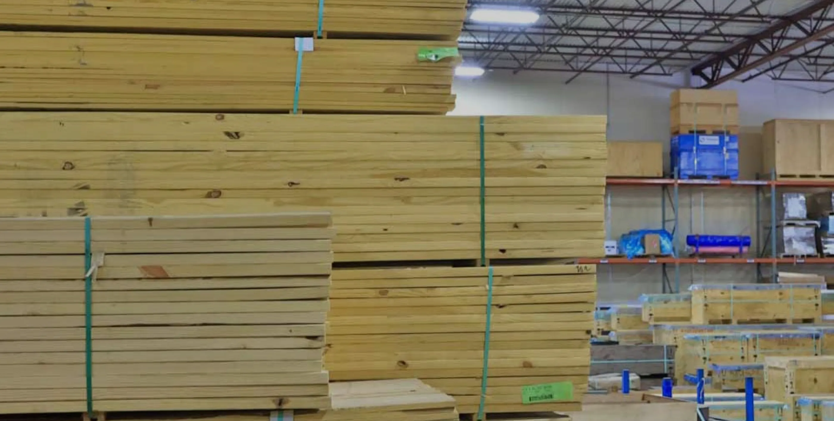 Industrial warehouse with lumber, shelving, and shipping materials
